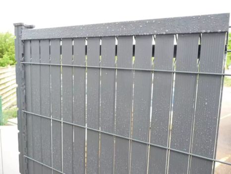 Plastic filling of mesh and panels made of PVC strips - 3D strips for fencing Gray color